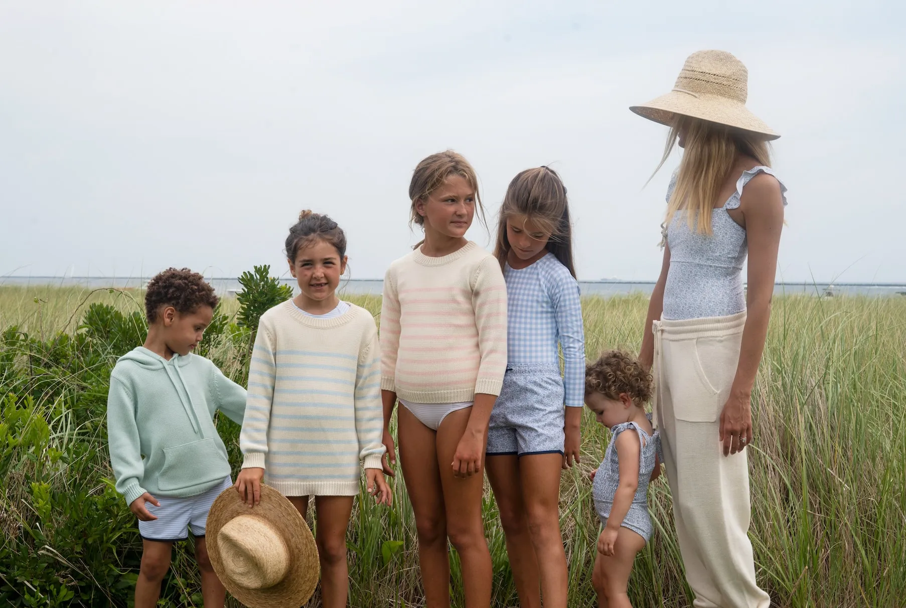 Kids on the beach in Minnow swimwear